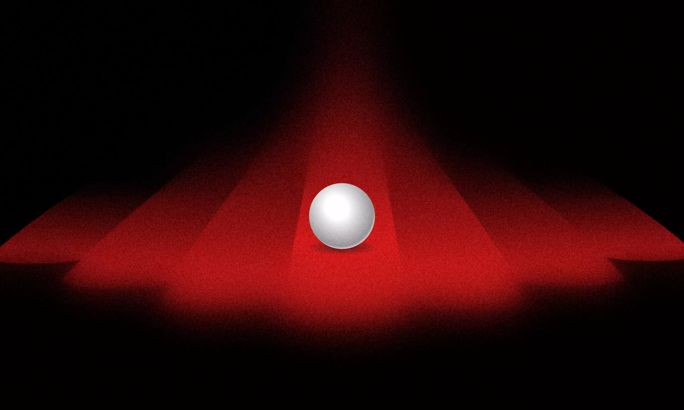A white, pearl-like ball illuminated by red spotlights, symbolizing the clarity and focus Ruby on Rails development companies bring to web development projects.