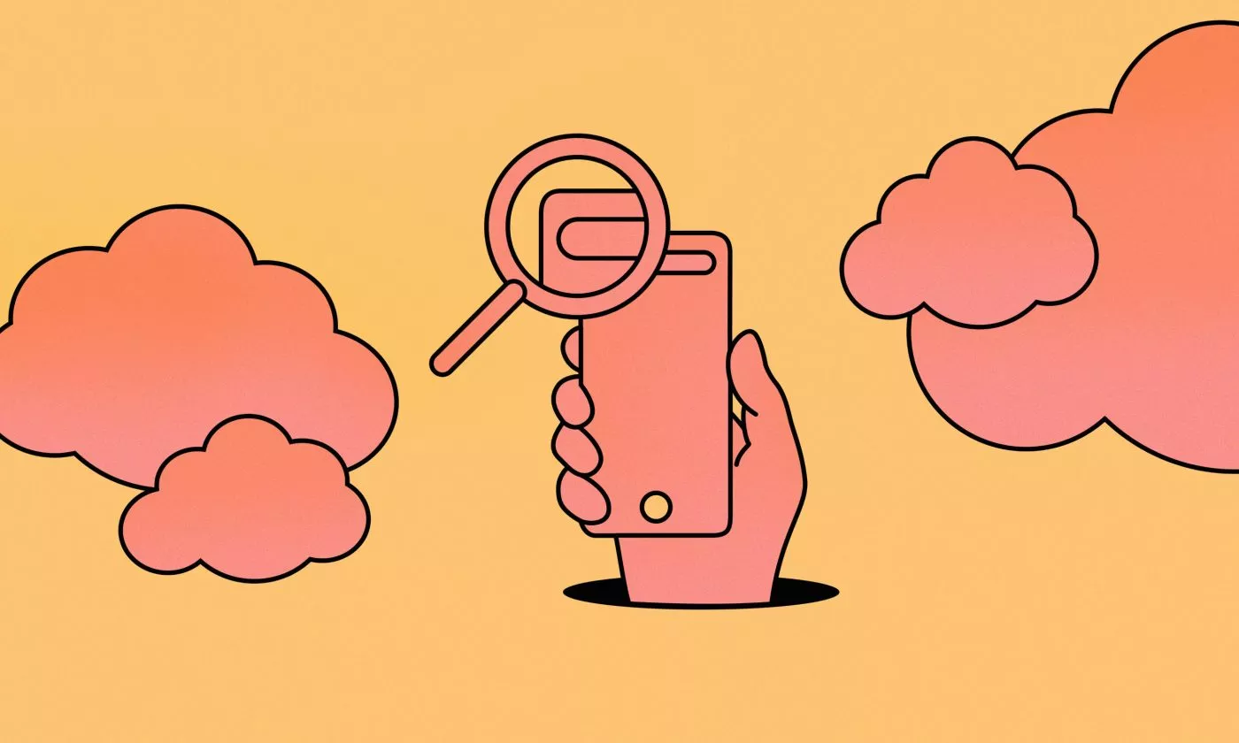 Magnifying glass over mobile phone symbolising accessible product design audit