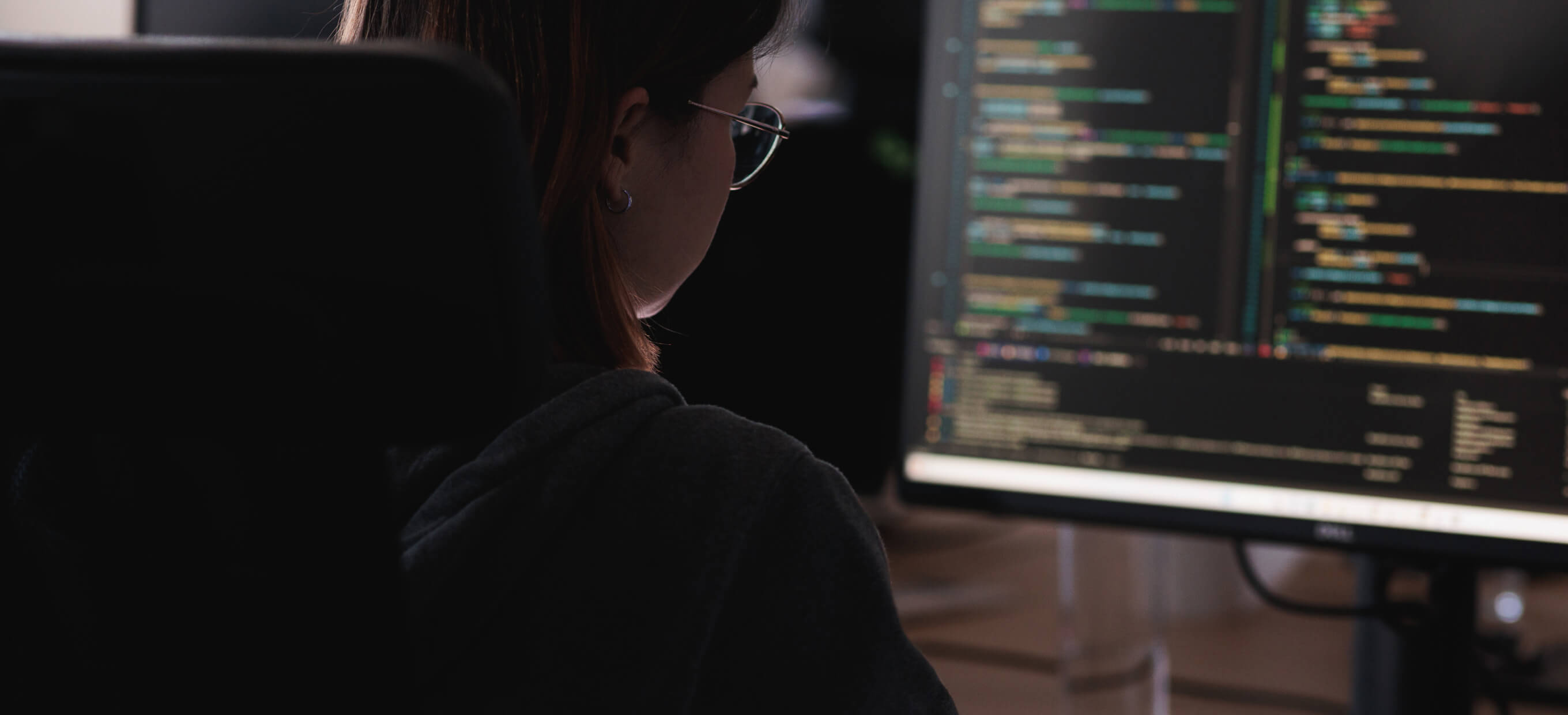 Person providing backend development services on a laptop